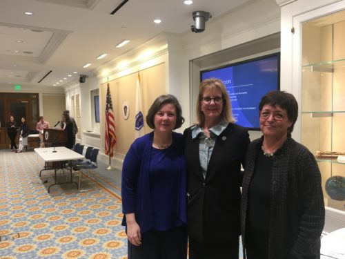 Co-sponsors, three legislators, smiling at the camera following the event at the State House.